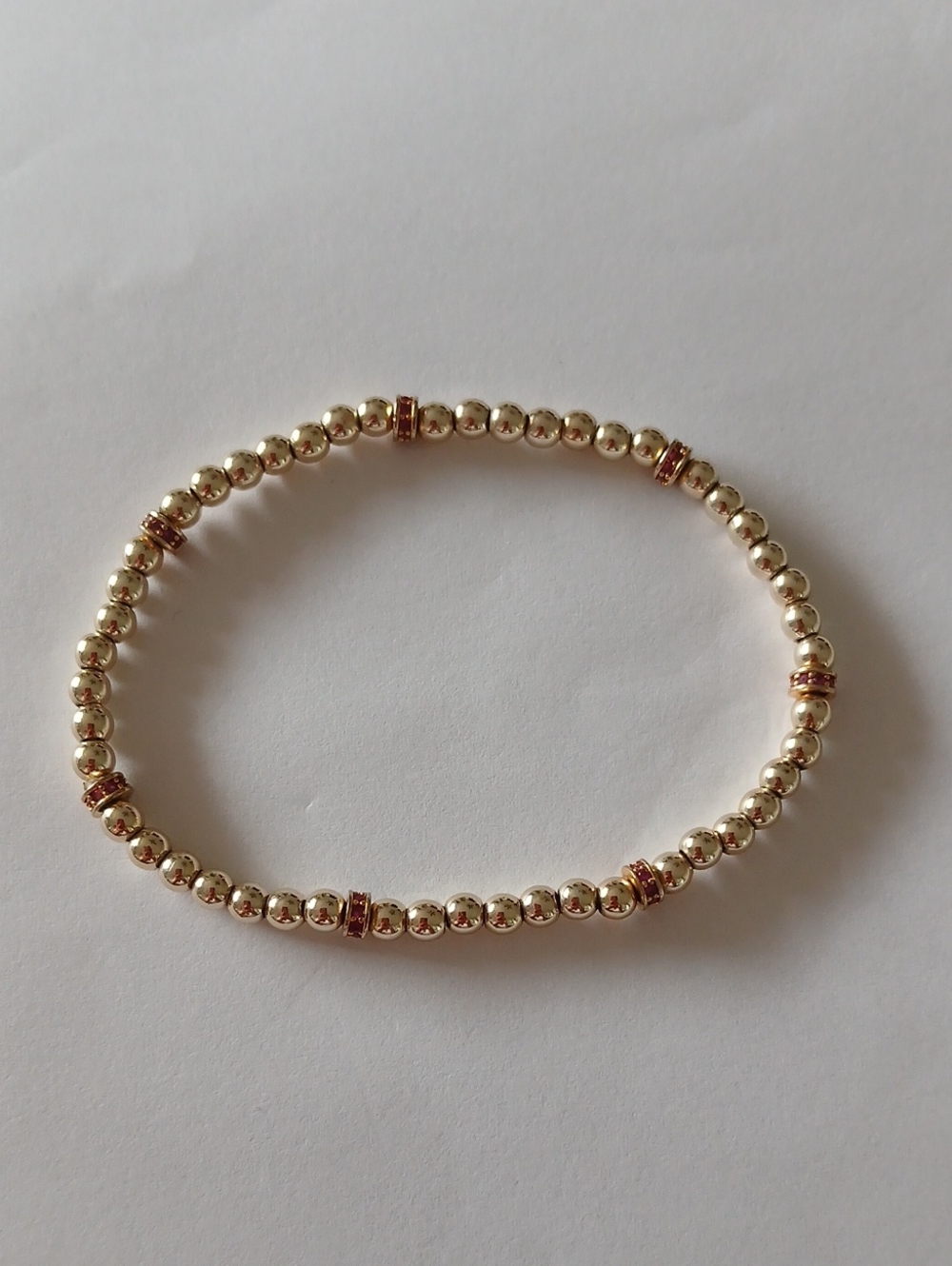 Gold Beaded Stretch Bracelet with Rose Gold Accent